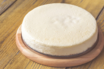 Traditional cheesecake on the wooden table