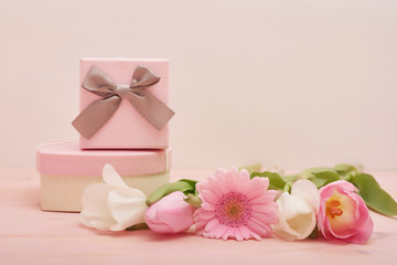 Fototapeta na wymiar Valentine's day composition pink gift box with flowers. Valentine card. Greeting card template. Space for text. Concept of Happy Valentine's day. Mother's day card. Spring flowers on pink background