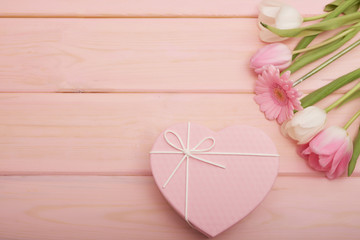 Valentine's day composition pink gift box with flowers. Valentine card. Greeting card template. Space for text. Concept of Happy Valentine's day. Mother's day card. Spring flowers on pink background