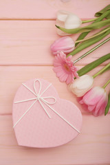 Valentine's day composition pink gift box with flowers. Valentine card. Greeting card template. Space for text. Concept of Happy Valentine's day. Mother's day card. Spring flowers on pink background