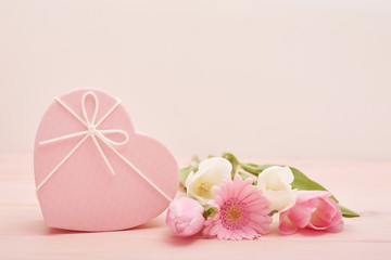 Obraz na płótnie Canvas Valentine's day composition pink gift box with flowers. Valentine card. Greeting card template. Space for text. Concept of Happy Valentine's day. Mother's day card. Spring flowers on pink background
