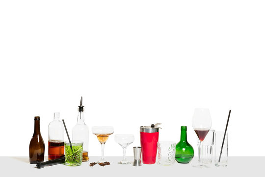 The many cocktails on the bar counter isolated on white. Nobody. International barman day, bar, alcohol, restaurant, party, pub, nightlife, cocktail, nightclub concept