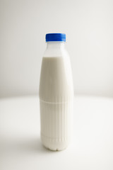 milk bottles on white table