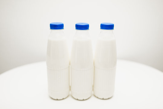 milk bottles on white table