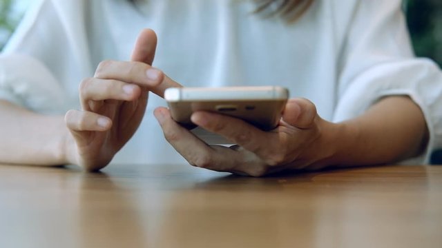 Young woman surfing internet on her smartphone