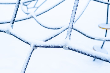 Empty snow covered playground in winter time