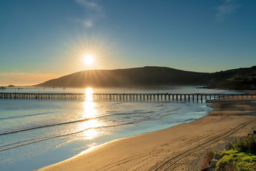 Setting Sun on Pier, Water, Beach