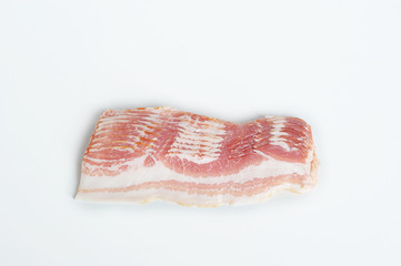 Slices of bacon on a white background. View from above.