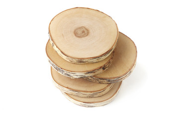 Serving wood tray stack isolated on white background. Cut birch tree round stump top view.