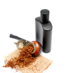 smoking tobacco pipe and men perfume bottle on white background