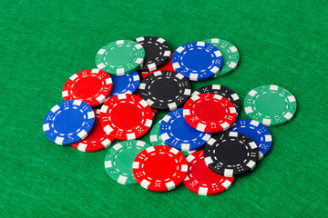 Casino chips on green table