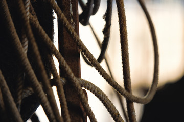 Western roping industry shown with rope close up in rustic country barn.