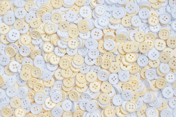 White and cream buttons for decoration and background