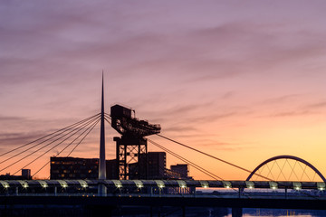 Finnieston Crane and Clyde Arc (Squinty Bridge) above the water of the Clyde at Pacific Quay, Glasgow, Scotland, UK