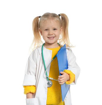 Cute Little Child In Doctor Coat With Stethoscope And Clipboard On White Background