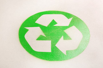 Recycling symbol on cardboard paper. Waste reuse concept