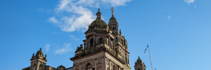 Fototapeta na wymiar Panoramic picture of the upper section of the Glasgow City Chambers' building, Glasgow, Scotland