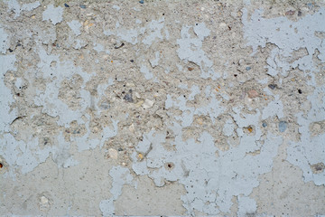 Stone wall with peeling paint