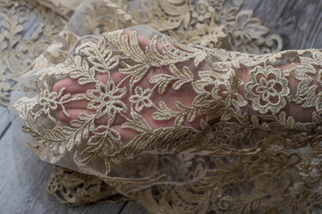 The texture of lace on wooden background