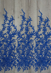 The texture of lace on wooden background