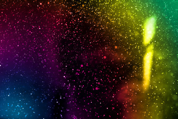 Abstract real color dust floating over black background.Dust paricles for overlay use in grunge design. Blurred dust concept.