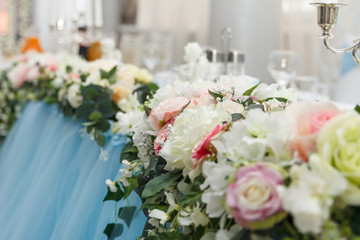 Flower wedding decoration with candles and angel