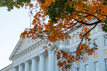 Pediment and colonnade of the main building of the University of Tartu, Estonia, during autumn, view from the intersection of streets Ulikooli and Gildi