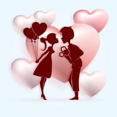 Light composition with the silhouette of a boy with a bouquet of flowers and a girl with balloons,