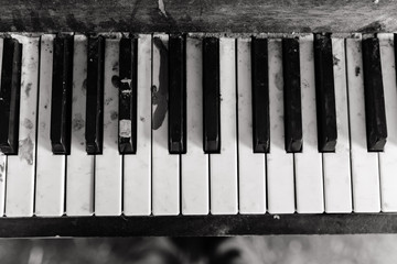 old piano keyboard keys on black background