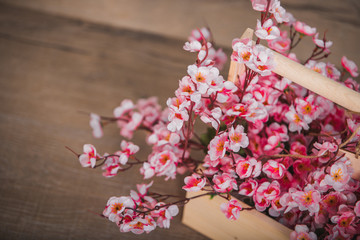 Sakura artificial flowers in a wooden box