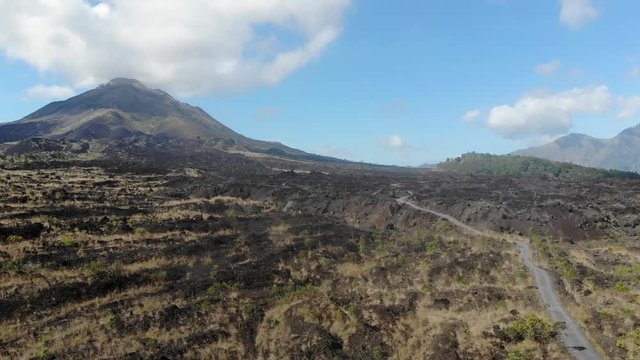 Aerial photography near the Batur volcano in the North of Bali. Around the frozen lava that burned everything around.