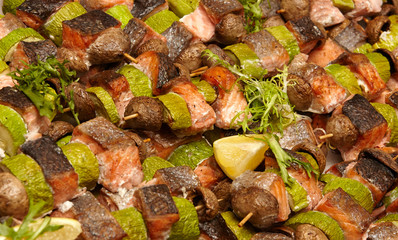 grilled vegetables and salmon with greens and lemon