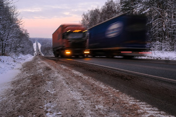 Naklejka na ściany i meble image of a truck on a winter road