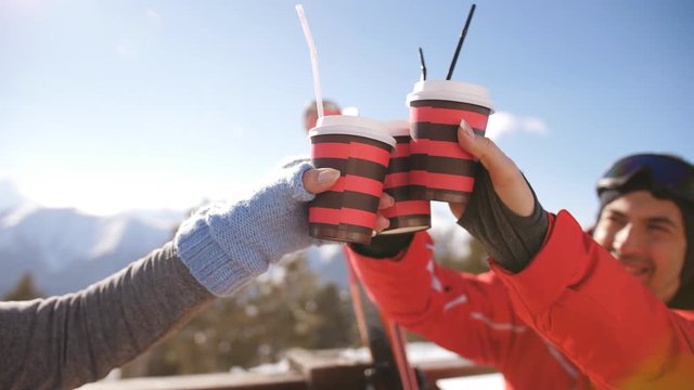 A group of friends celebrating a great winter day after skiing at the ski resort.