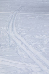 Fototapeta na wymiar Traces from skis on snow