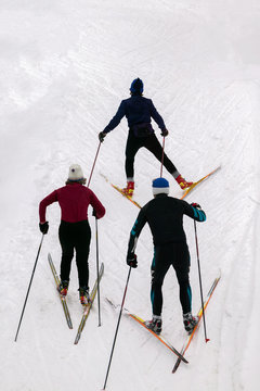 Three cross country skiers.