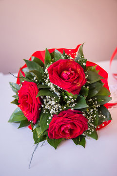 Closeup photo of beautiful wedding bouquet of red roses