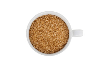 Brown sugar in white cup isolated on white background