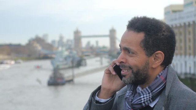 African businessman takes a phone call in London