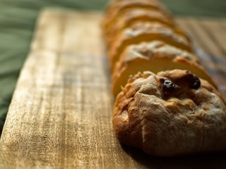 Ciabatta. homemade italian ciabatta bread top view. Bread with cheese. Sliced fresh bread on a wooden tray.