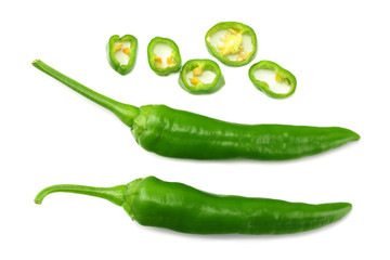 green hot chili peppers with slices isolated on white background top view