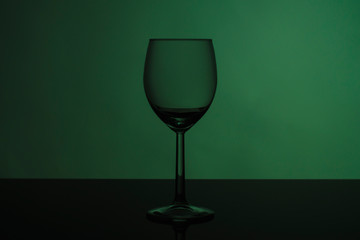 Wine glass on glossy black glass