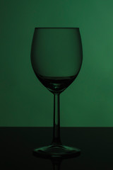 Wine glass on glossy black glass