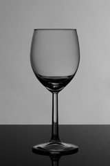 Wine glass on glossy black glass