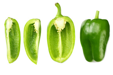 cut slices of green sweet bell pepper isolated on white background top view