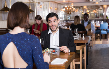 Portrait of couple who is dining and drinking wine