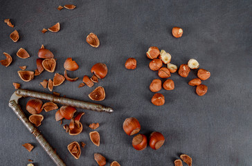 wooden surface is nutcracker hazelnuts on a old wooden table
