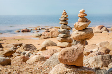 Zen pyramid of stones on seashore.Concept harmony and balance,spa and yoga