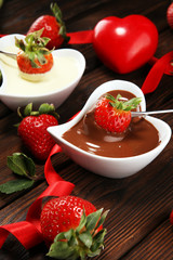 Valentine Chocolate fondue melted with fresh strawberries and dark and white chocolate. Tublips and sugar hearts.