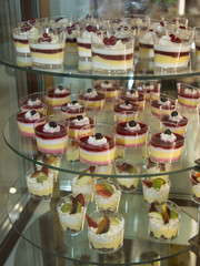 Single Portions of Mousse Packaged inside a Pastry Display Stand